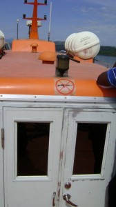 Orange roofed river boat